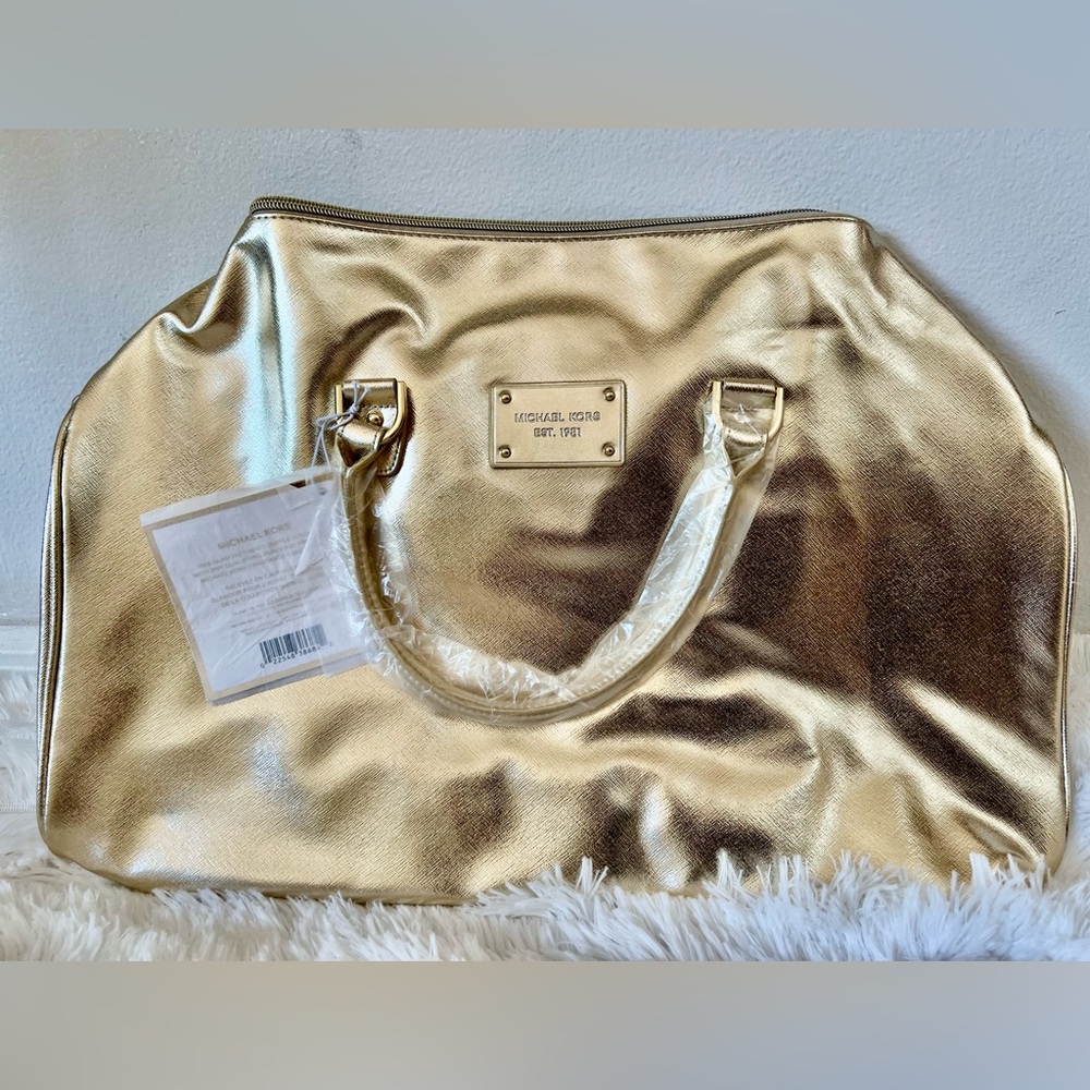 Michael Kors Duffel Bag. Color: Off Gold metallic